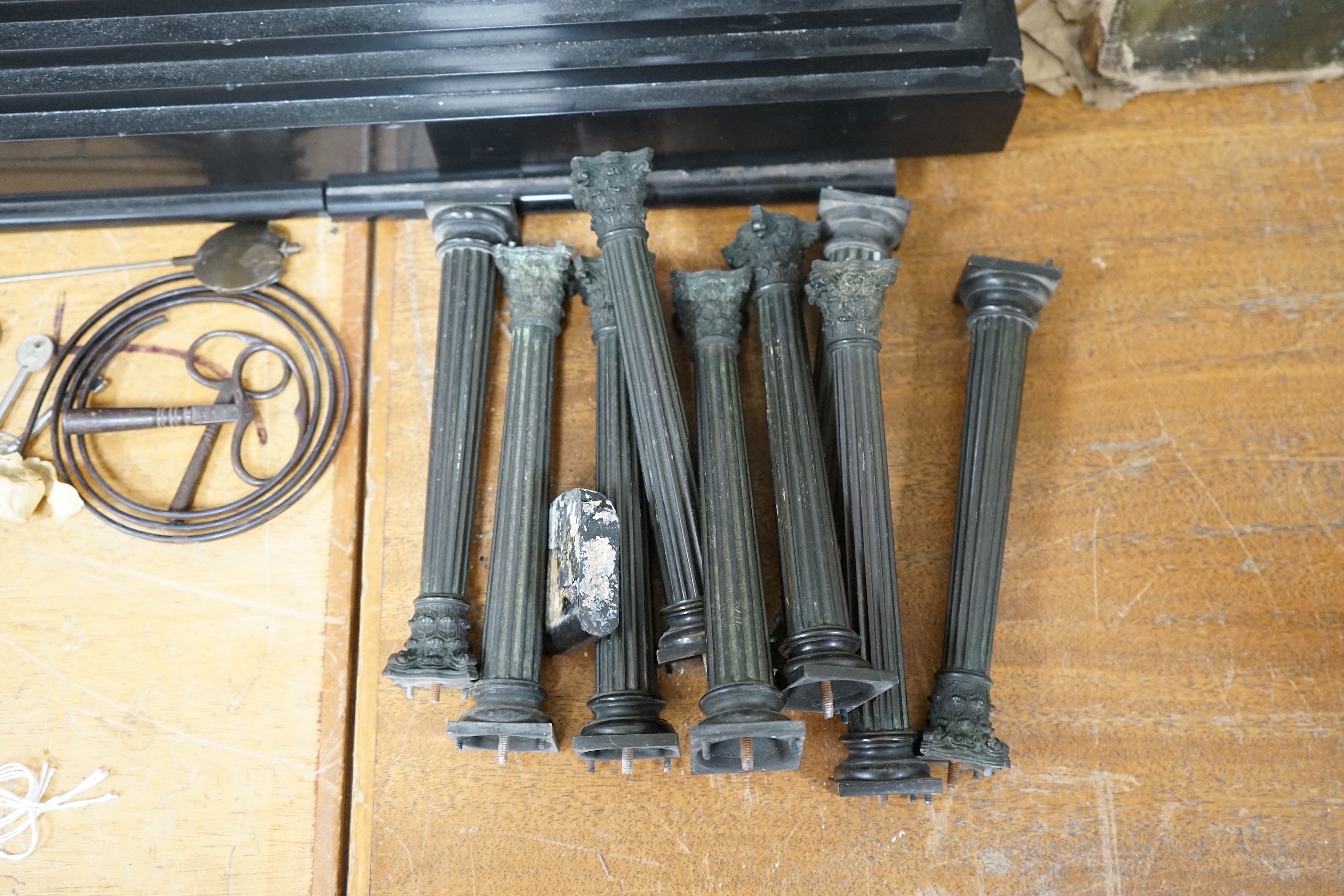 A Victorian black slate mantel clock, 54.5cm wide. Condition - columns and some clock parts loose